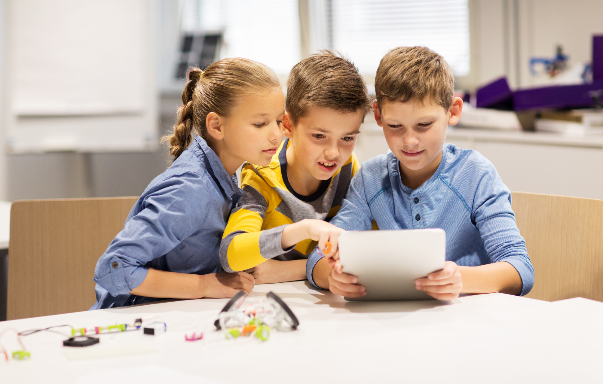 Kids with Tablet Pc Programming at Robotics School